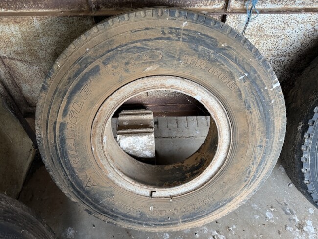 077 115 Tyre with rim Triangle TR666 10.00 R20 good suit trailer or steer drive